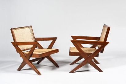 null PIERRE JEANNERET (1896 - 1967) "Cross easy chair" Pair of solid teak armchairs...
