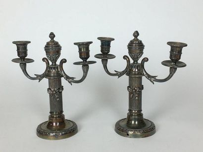 null Pair of silver-plated bronze candelabra with two moving light arms. The fluted...