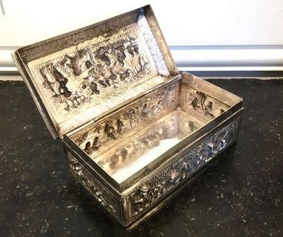null Rectangular box in embossed silver decorated with animated scenes of people...