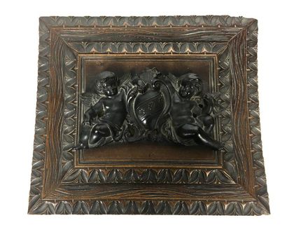null Moulded and carved oak casket with decoration on top of a stylised coat of arms....