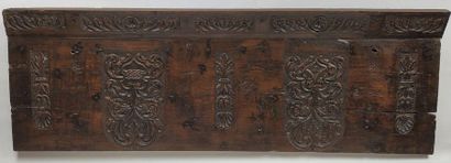 null CASE FACADE in walnut carved in bas-relief with decoration of shields and symmetrical...