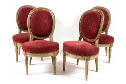 null Suite of FOUR CHAIRS with medallion backrest in moulded grey lacquered wood...