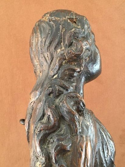 null HOLY WOMAN in carved wood. Standing, her hair loose falling down in the back,...