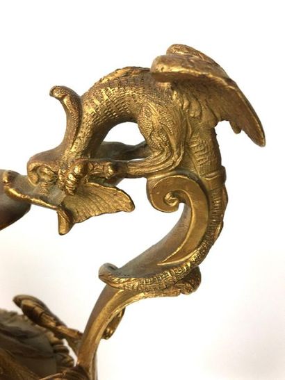 null PAIR OF GOLDED BRONZE EAGGERS chiselled with wavelets and a mascaron, the pedestal...