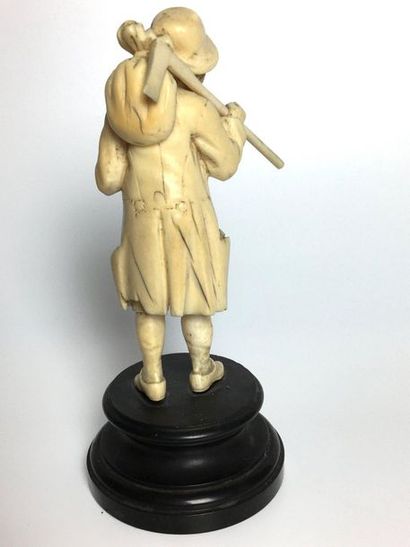 null SUBJECT in carved ivory representing a peasant. Black marble base. NORTH SCHOOL,...