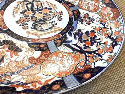 null JAPAN Large circular porcelain dish decorated in the Imari palette of flowers....