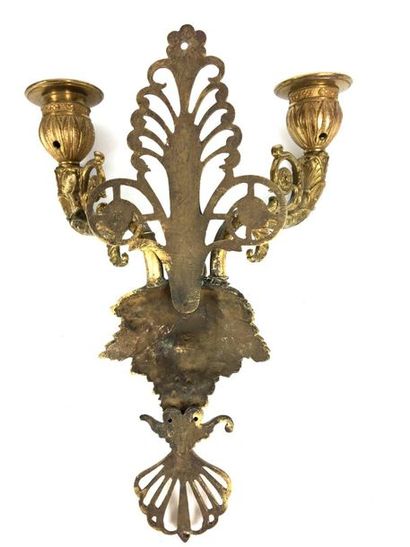 null Suite of FOUR Sconces in chased and gilt bronze with two moving light arms joined...