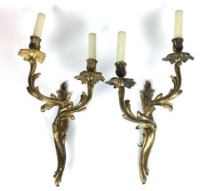 null Pair of ormolu and chased bronze sconces with two moving and foliated light...