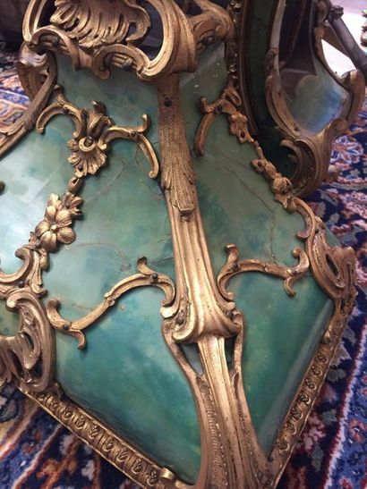 null CARTEL AND ITS CONSOLE in green horn veneer and gilded bronze, the enamelled...