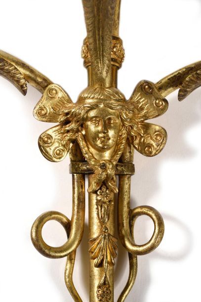 null Pair of chased and gilded bronze sconces with three light arms depicting the...