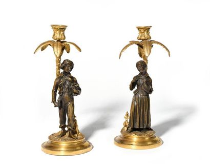 null Paire de flambeaux en bronze patiné et bronze doré représentant Paul et Virginie...