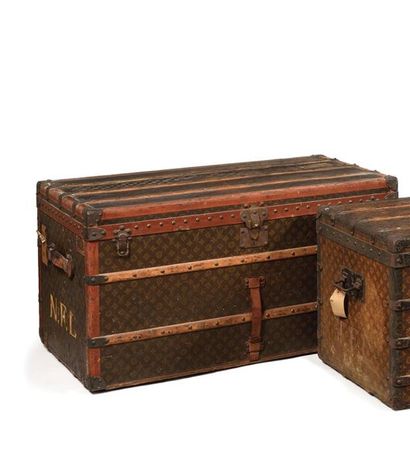 null LOUIS VUITTON Coated monogrammed canvas trunk, natural leather edges, iron and...