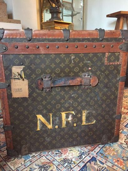 null LOUIS VUITTON Coated monogrammed canvas trunk, natural leather edges, iron and...
