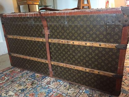  LOUIS VUITTON Coated monogrammed canvas trunk, natural leather edges, iron and brass...