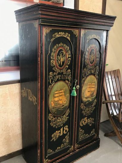 null Cupboard with two doors in painted dot with English ships in medallions. 

Height...