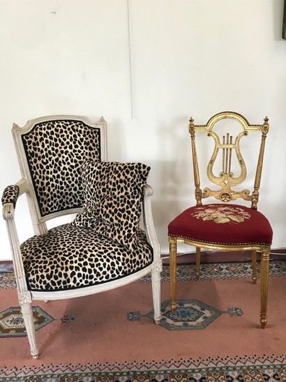 null White lacquered Louis XVI style armchair, leopard trim. A Napoleon III gilded...