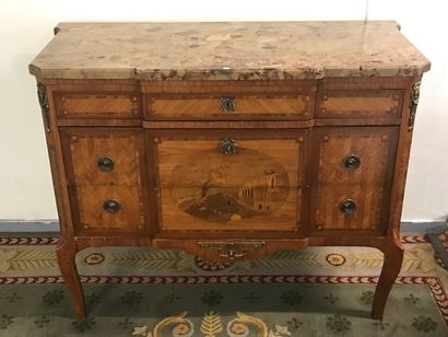 null Transition style chest of drawers with central projection in marquetry and gilt...