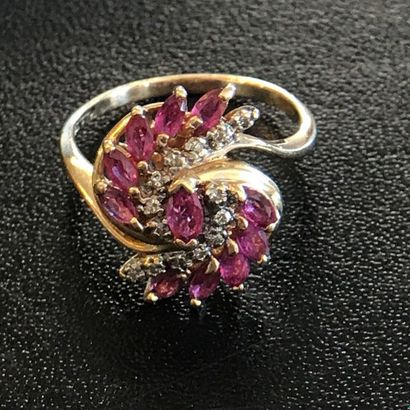 null RING in 14k yellow gold adorned with rubies and diamonds in a coiled movement....