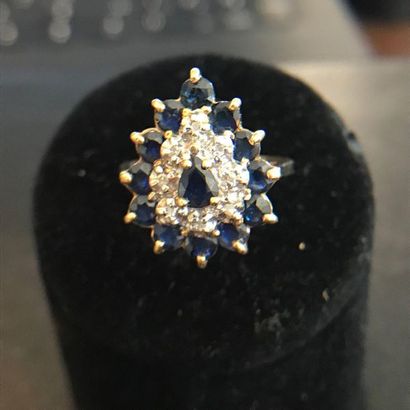 null RING in 14k yellow gold adorned with sapphires and diamonds forming a drop....