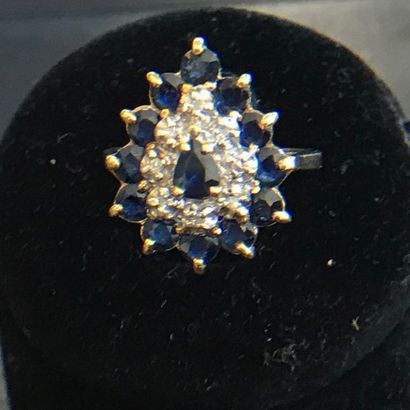 null RING in 14k yellow gold adorned with sapphires and diamonds forming a drop....
