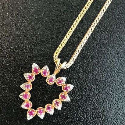 null 14k yellow gold heart shaped pendant decorated with rubies and diamonds on a...