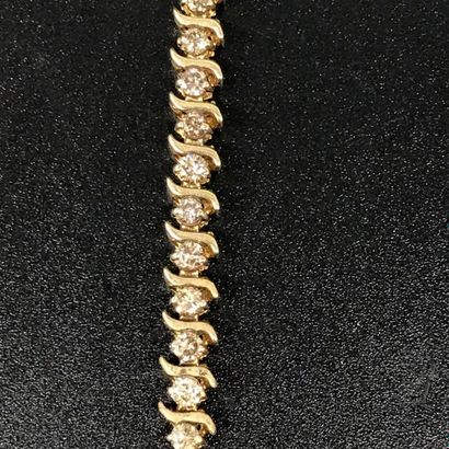 null BRACELET in 10k yellow gold set with small diamonds for a total of about 2Ct....