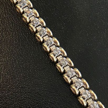 null 10k yellow gold bracelet decorated with small diamonds all around. 

Length...