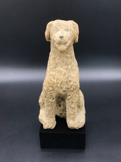 Stone sculpture of a sitting dog. 
Signed...
