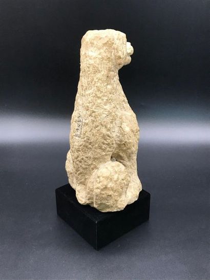  Stone sculpture of a sitting dog. 
Signed Karly on the back 
Height 29 cm