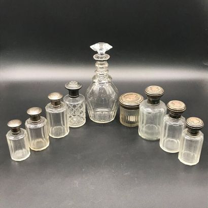 Eight toilet flasks and a carafe in cut crystal,...