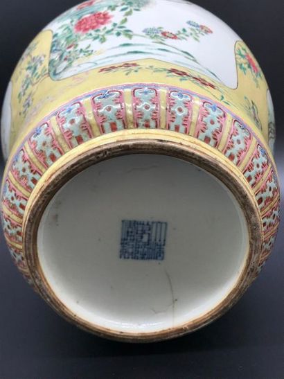 null A covered porcelain jar with a yellow background decorated with chrysanthemums,...