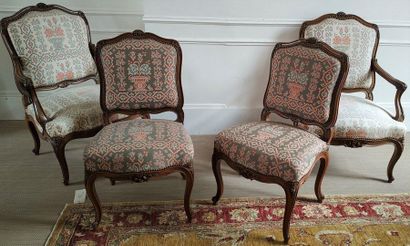 null PAIR OF FALLS and PAIR OF CHAIRS in moulded and carved wood with a moving backrest....