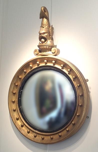 null Gilded wooden witch's mirror in oval shape with a dolphin on top. High. Total:...