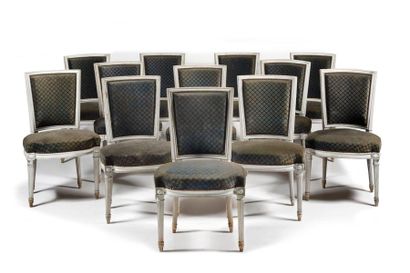 null Twelve moulded and painted beech chairs with curved backs and recessed front...