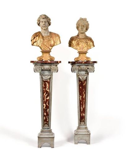 null Pair of moulded and painted wooden sheaths in faux marble, the indented top...