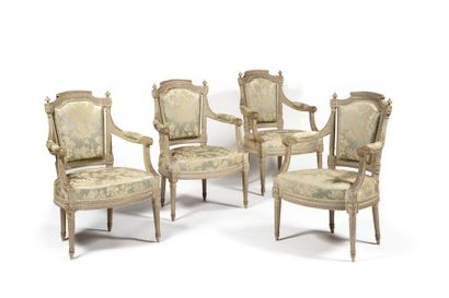 null A suite of four armchairs in moulded, sculpted and painted, with detached convertible...