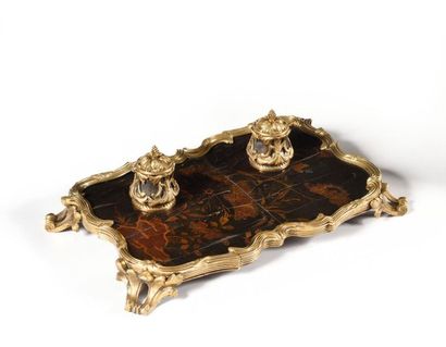 null Lacquer and gilt bronze inkwell resting on four scroll feet. Louis XV style...