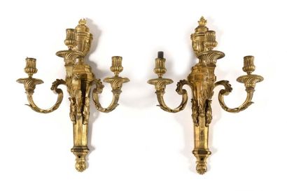 null Large pair of gilt bronze sconces with three branches and decoration of vases...