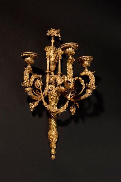 null Pair of important arms of light in chased and gilded bronze (two tones of gold),...