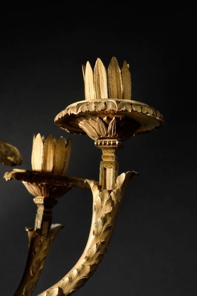 null Pair of three-branched gilt bronze light arms, the scrolled shaft surmounted...