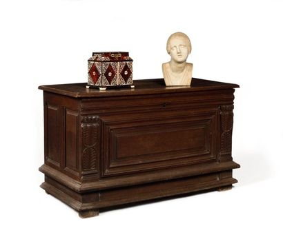 null Oak chest with a central panel and moulded frame. Uprights adorned with large...