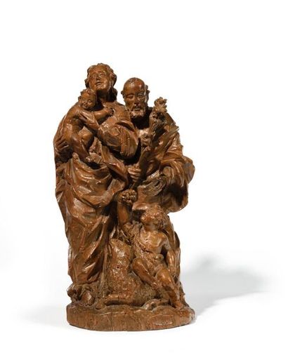 null Sainte Famille en noyer sculpté, dos ébauché. La Vierge porte l’Enfant Jésus...
