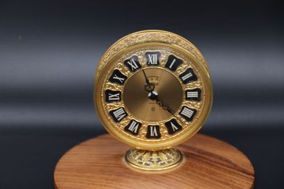  JAEGER Recital Clock. Jaeger 8-day gold-plated brass clock. Round case, signed gilded...