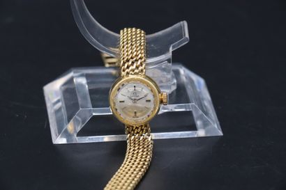  OMEGA Ref: 511172, circa 1960. Lady's watch in 18 k yellow gold. Round case, faceted...