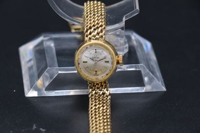  OMEGA Ref: 511172, circa 1960. Lady's watch in 18 k yellow gold. Round case, faceted...