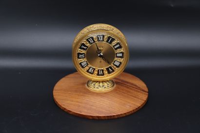  JAEGER Recital Clock. Jaeger 8-day gold-plated brass clock. Round case, signed gilded...