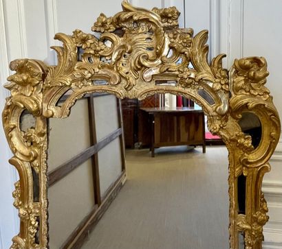 null Large MIRROR with moving shaped glass panes in gilded wood molded and carved...