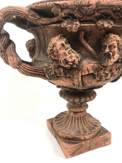 null MEDICIS VASE in terracotta. Decoration of masks on the belly. Intertwined branch...