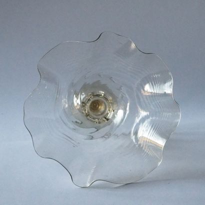null CUP in undulating corolla on a tubular and spherical pale yellow glass leg decorated...