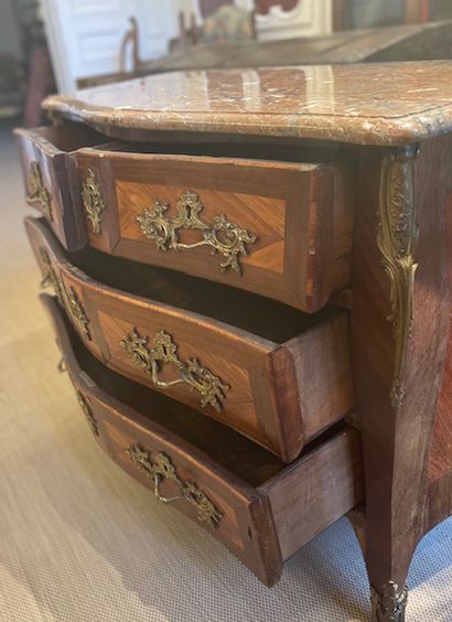 null Veneer and marquetry COMMODE opening in front by four drawers on three rows....